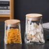 طقم برطمانات زجاج قطعتين لحفظ وتنظيم الشاي والسكر والقهوة مقاسات مختلفه غطاء خشب محكم الغلق