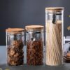 طقم برطمانات زجاجي 3 قطع احجام مختلفة بغطاء خشبي محكم الغلق لحفظ وتخزين الشاي والسكر والحبوب والبقوليات
